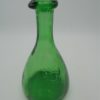 carafe en verre vert ecusson lions